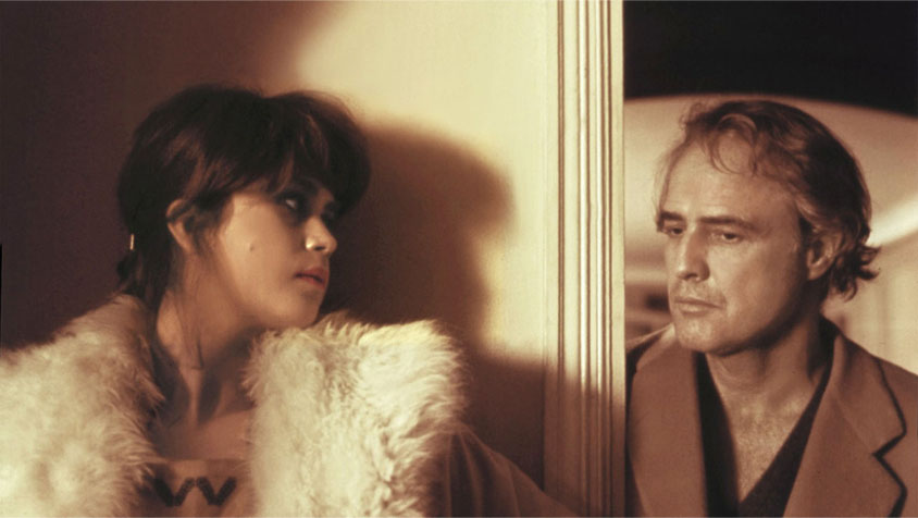 a still image of the two main characters from Last Tango in Paris looking at each other