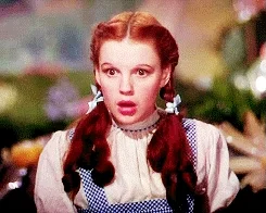 Judy Garland in The Wizard of Oz putting her hand to her face in shock