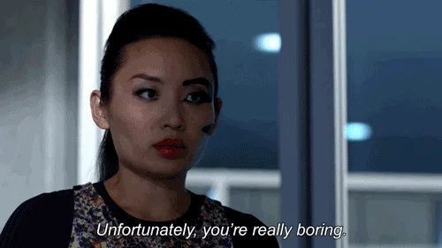 An asian woman saying “unfortunately, you’re really boring”