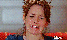 An animated gif of a woman sobbing